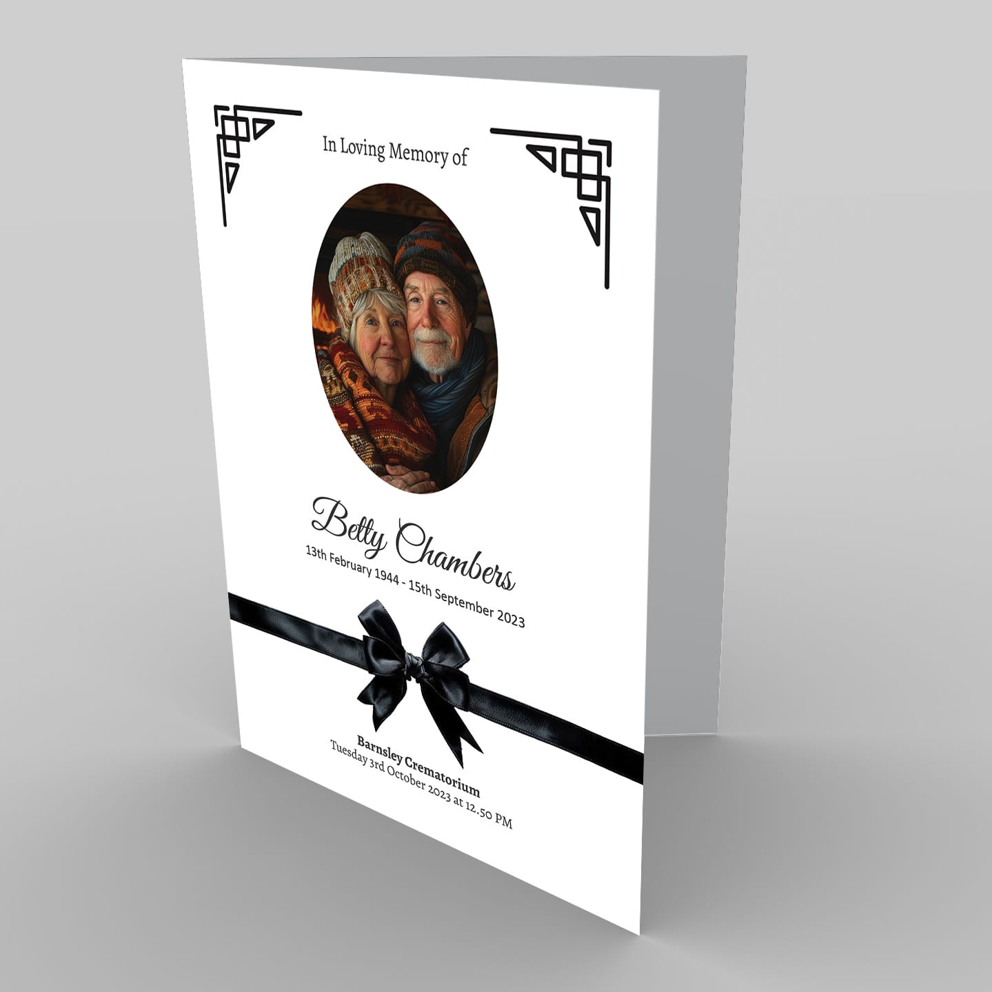 A black and white memorial card with an image of two people surrounded by 1 Forget Me Not Flowers (Copy).