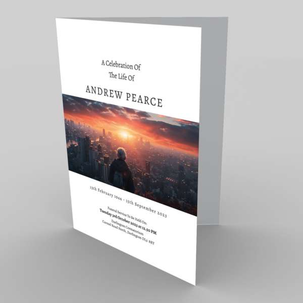 A funeral program featuring a 9.6.7 Photo Edge of a sunset cityscape to honor the life of Andrew Pearce.